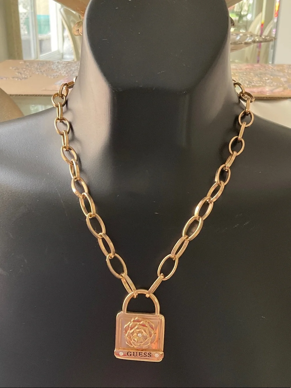 GUESS Gold Padlock Pendant with Floral Accent